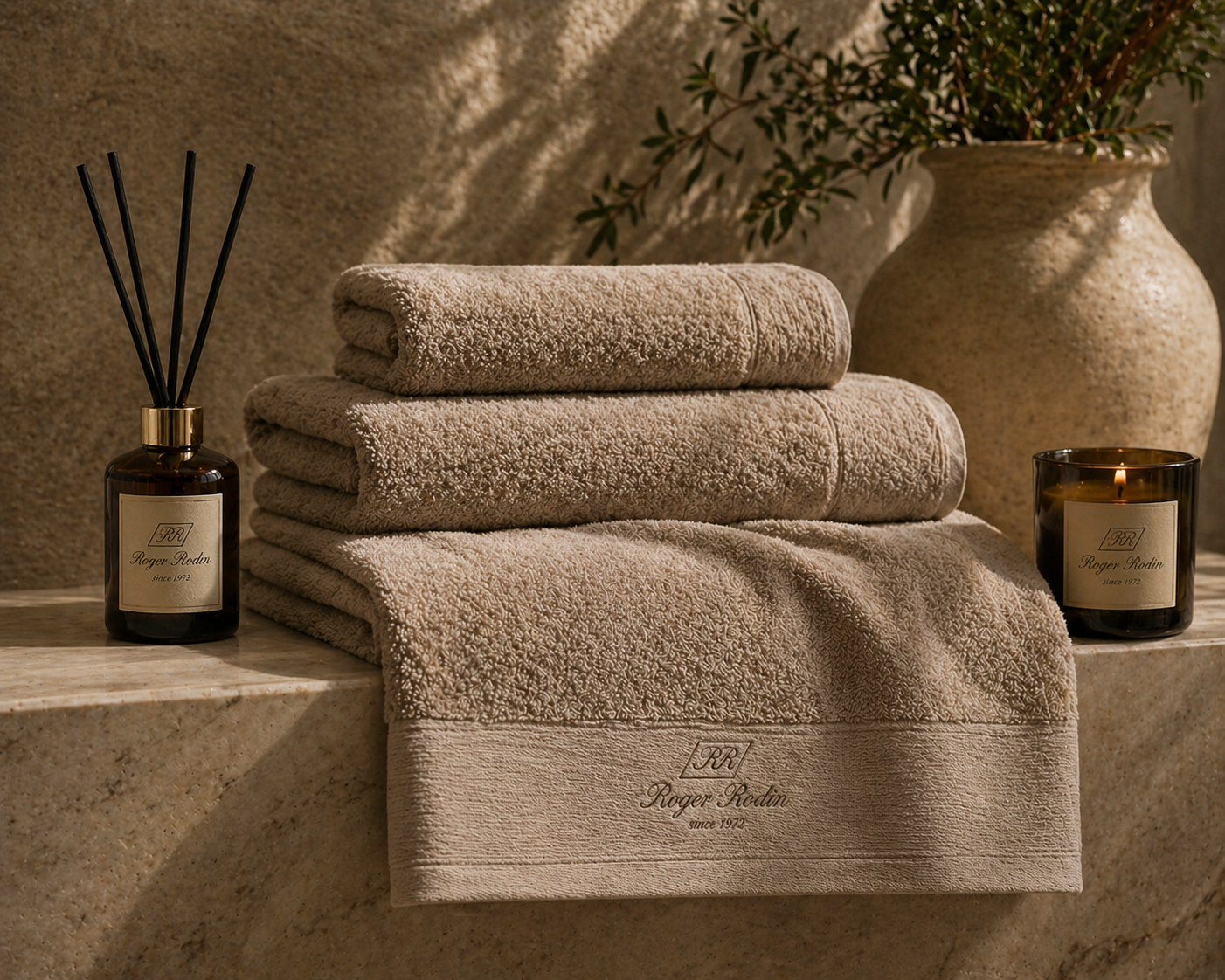 Roger Rodin embroidered towels with reed diffuser and signature candle.